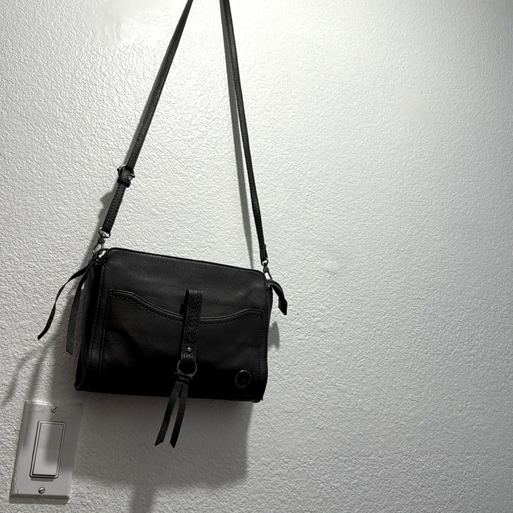 The Sak Crossbody w/ Studded Zip Pouch with the Sak leather wallet.